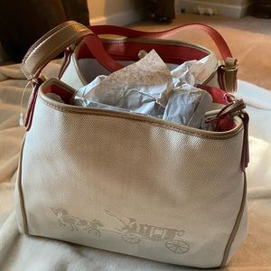 Very beautiful orange and tan coach handbag. Brand new.